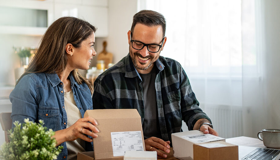 Woman and man looking at received packages